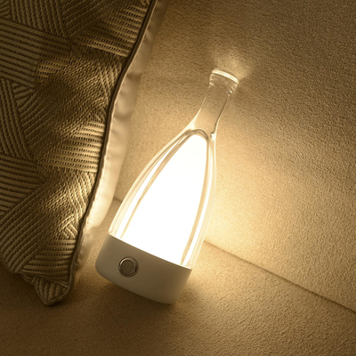 Forma borracha de encargo tricolor moderna multifuncional de la botella de la lámpara de mesita de noche del hotel